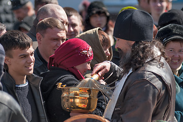 Image showing Priest blessing people with holy water. Tyumen