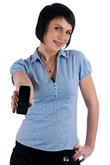 Image showing Beautiful brunette girl shows mobile on phone