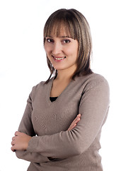 Image showing Smiling brunette woman over white