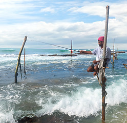 Image showing Fisherman on stick