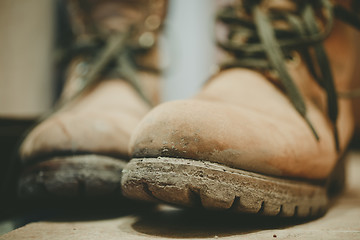 Image showing Old and Dirty boots in mud