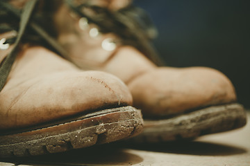 Image showing Old and Dirty boots in mud