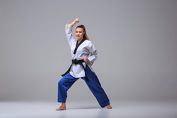 Image showing The karate girl with black belt 