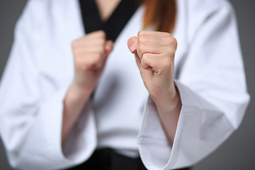 Image showing The karate girl with black belt 