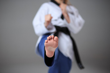 Image showing The karate girl with black belt 