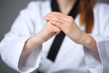 Image showing The karate girl with black belt 