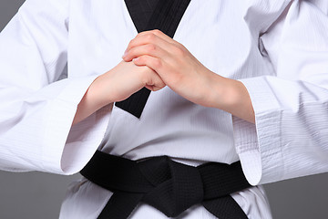 Image showing The karate girl with black belt 