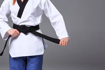 Image showing The karate girl with black belt 