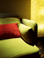 Image showing Detail of living room with lamp and green sofa