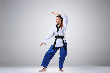 Image showing The karate girl with black belt 