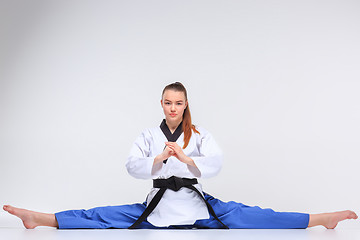 Image showing The karate girl with black belt 