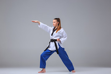 Image showing The karate girl with black belt 