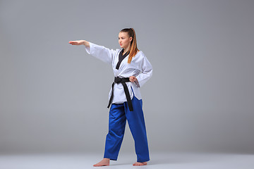 Image showing The karate girl with black belt 