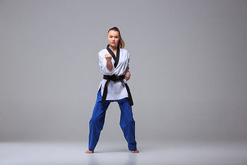 Image showing The karate girl with black belt 