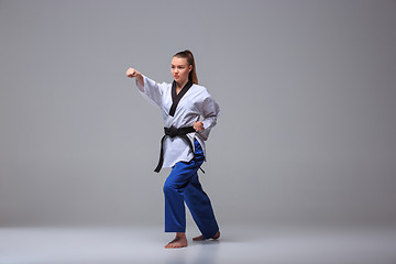 Image showing The karate girl with black belt 