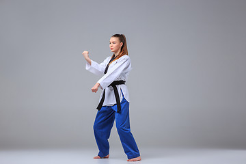 Image showing The karate girl with black belt 