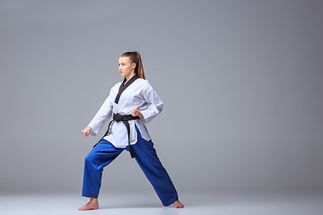 Image showing The karate girl with black belt 