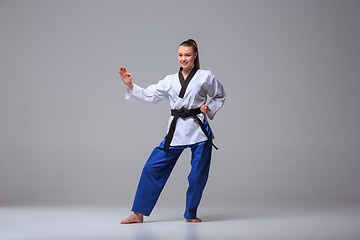 Image showing The karate girl with black belt 