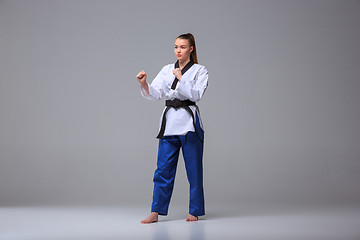 Image showing The karate girl with black belt 