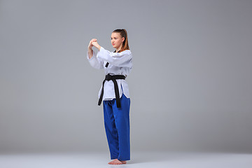 Image showing The karate girl with black belt 