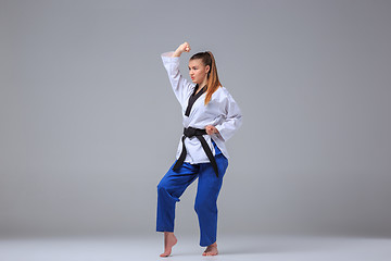 Image showing The karate girl with black belt 