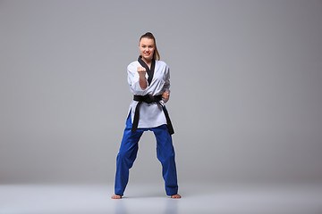 Image showing The karate girl with black belt 