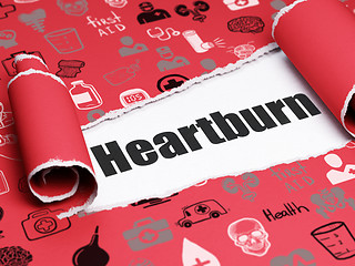 Image showing Medicine concept: black text Heartburn under the piece of  torn paper