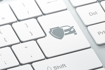 Image showing Insurance concept: Car And Shield on computer keyboard background