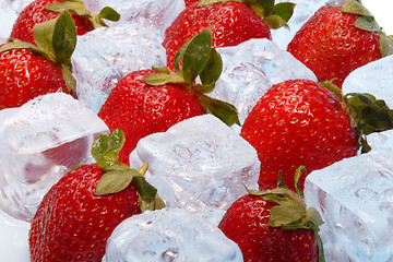 Image showing strawberries in piece of ice