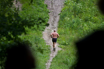 Image showing Man running in a Forest