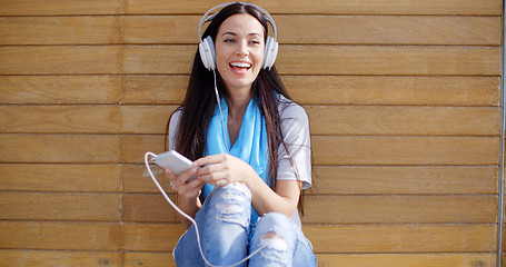 Image showing Happy woman enjoying her music