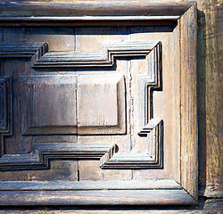 Image showing   blur   abstract   rusty brass brown knocker in a  door curch  