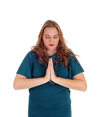 Image showing Praying woman with hands folded.