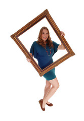 Image showing Woman holding a  picture frame.