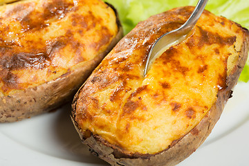 Image showing baked potatoes whole in their skins 