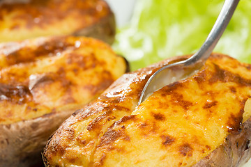 Image showing baked potatoes whole in their skins 