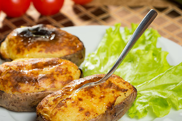 Image showing baked potatoes whole in their skins 