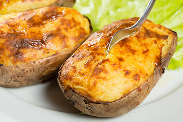 Image showing baked potatoes whole in their skins 