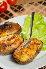 Image showing baked potatoes whole in their skins 