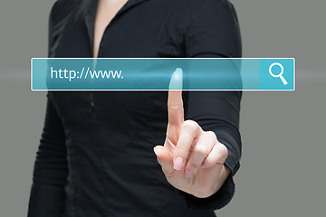 Image showing Young woman touching web browser address bar with www sign