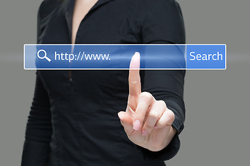 Image showing Young woman touching web browser address bar with www sign