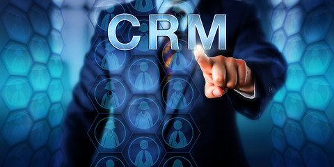 Image showing Manager Pushing CRM Onscreen\r