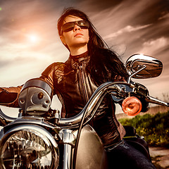 Image showing Biker girl on a motorcycle