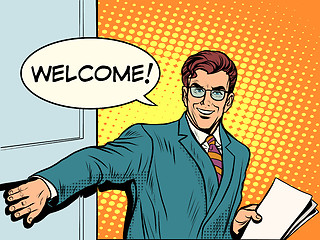 Image showing Welcome businessman opens the door