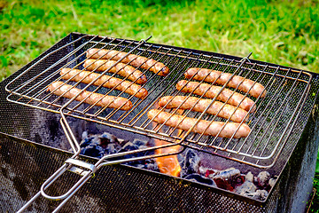 Image showing Grilling sausages