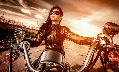 Image showing Biker girl on a motorcycle