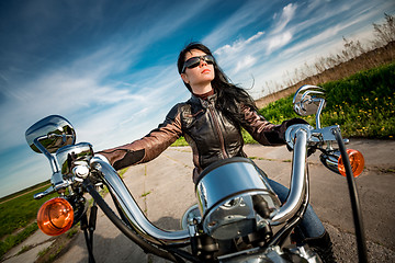 Image showing Biker girl on a motorcycle