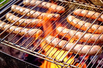 Image showing Grilling sausages