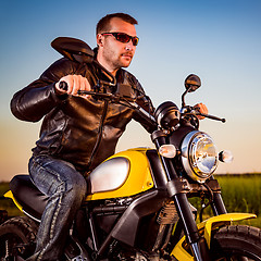 Image showing Biker on a motorcycle