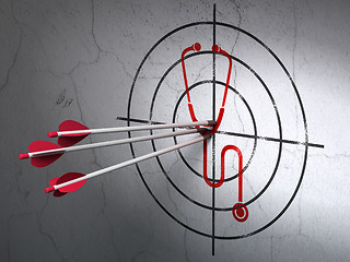 Image showing Medicine concept: arrows in Stethoscope target on wall background